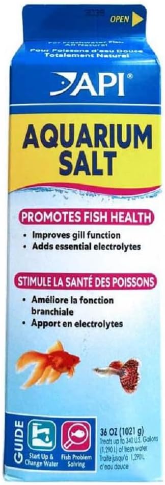 API Aquarium Salt Freshwater Fish Care Treatment Mars displayed next to measuring spoon and freshwater aquarium